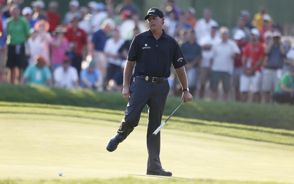 Phil Mickelson reacts to missing a putt on the 16th hole during the second round of the PGA Championship