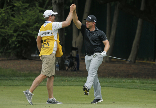 Daniel Summerhays right celebrates with his caddie Nick Jones left after making an eagle on the second hole during the third round of the PGA Championshi