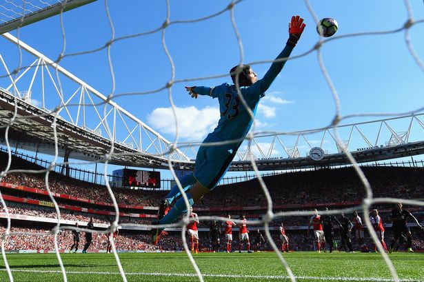 Philippe Coutinho's free kick curls past Petr Cech and into the top corner