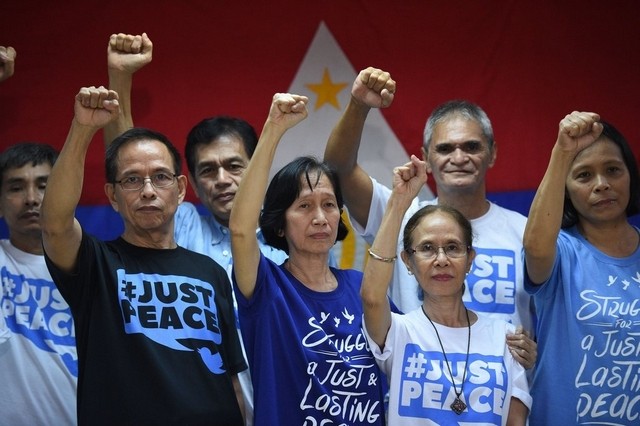 Philippines frees top communist leaders to join peace talks