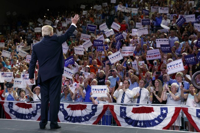 Donald Trump waves to supporters at a campaign rally at the University of North Carolina Wilmington on Tuesday August 9