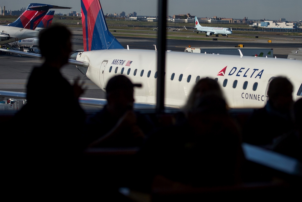 Delta flights grounded by 'system outage'