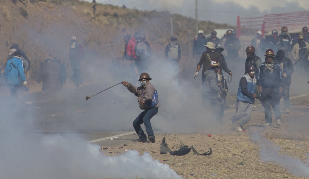 Striking Bolivian miners beat a deputy minister to death