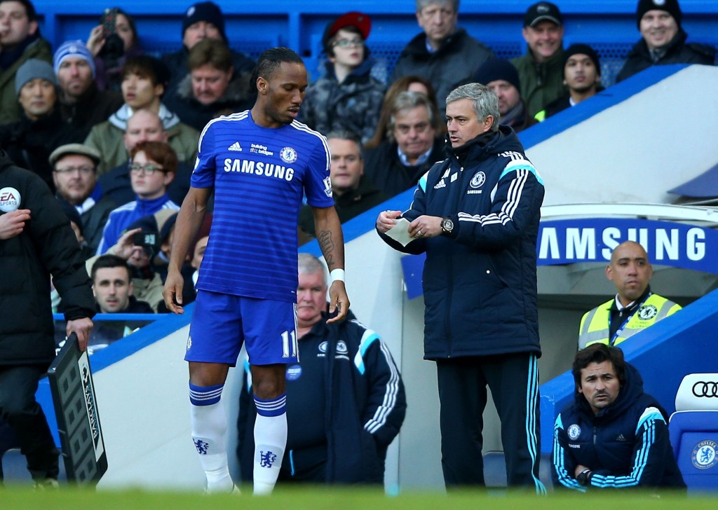 LONDON ENGLAND- FEBRUARY 21 Jose Mourinho the manager of Chelsea sends on Didier Drogba of Chelsea as a second half substitiute during the Barclays Premier League match between Chelsea and Burnley at Stamford Bridge