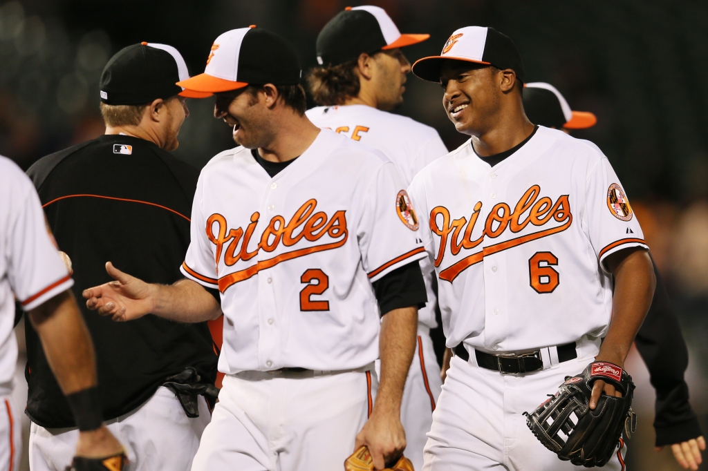 BALTIMORE MD- SEPTEMBER 25 J.J. Hardy #2 and Jonathan Schoop #6 of the Baltimore Orioles celebrate after the Orioles defeated the Toronto Blue Jays 9-5 at Oriole Park at Camden Yards