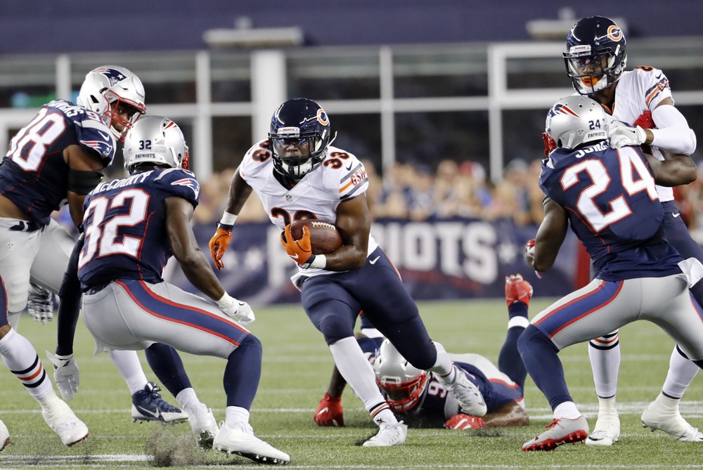 18 August 2016 Chicago Bears running back Jeremy Langford eyes New England Patriots defensive back Devin Mc Courty . The New England Patriots defeated the Chicago Bears 23-22 in a preseason NFL game at Gillette Stadium in Foxborough Massachuset