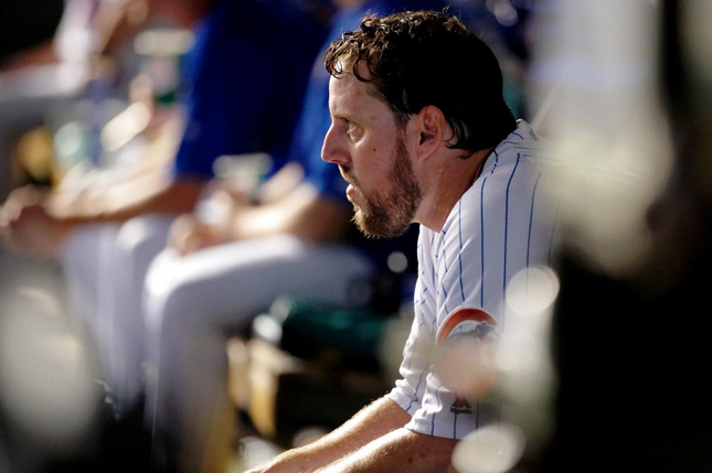 John Lackey reacts as he sits in the dugout after being taken out of the game against the St. Louis Cardinals during the seventh inning at Wrigley Field Sunday night