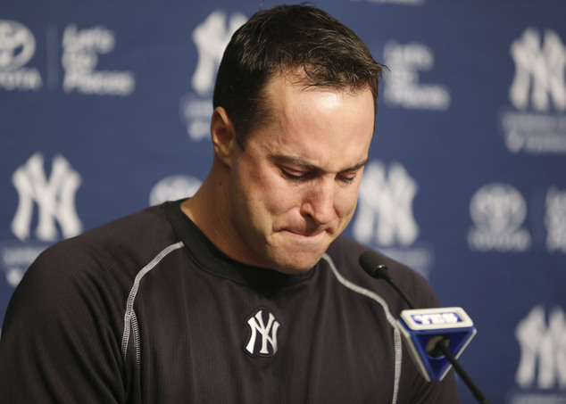 New York Yankees baseball player Mark Teixeira becomes emotional while talking to reporters at a press conference before a game against the Cleveland Indians