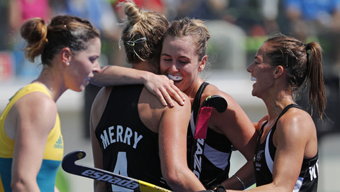 Players from New Zealand celebrate after scoring against Australia during a women's field hockey quarter final match