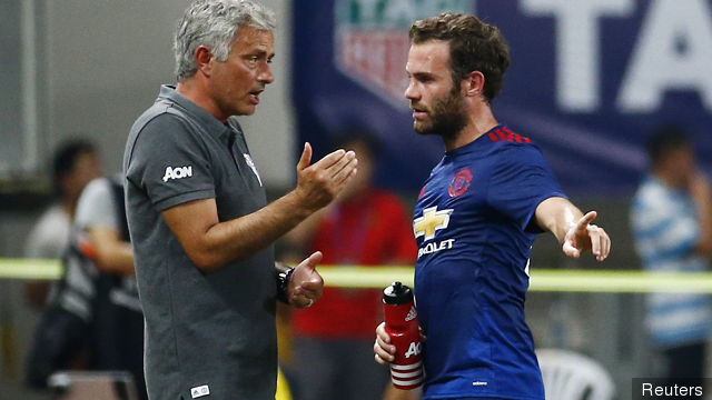 Manchester United manager Jose Mourinho talks with Juan Mata