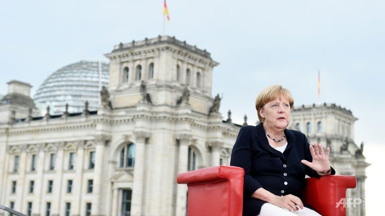 Sources deny report Merkel delaying announcement on possible fourth term