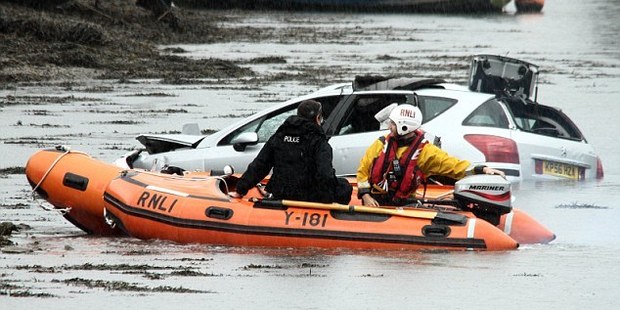 Police and emergency service attend the scene at Hooe Lake Plymouth Devon in the UK