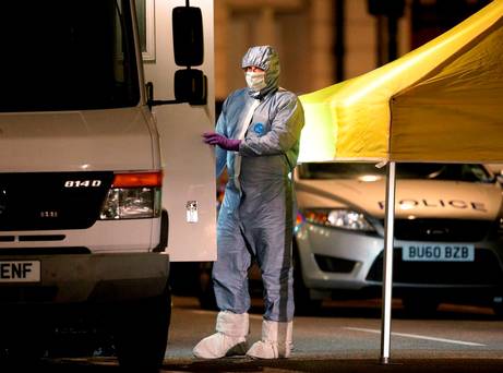 Police forensic officers in Russell Square central London after a knife attack in which a woman in her 60s was killed and five people were injured