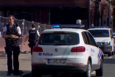 Police guard a police building in the southern Belgian city of Charleroi after a machete attack Saturday. Screen shot from the Independent