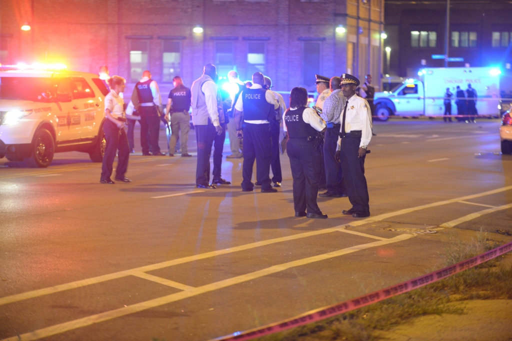 Police investigate a shooting involving the Illinois State Police Thursday near 77th and Vincennes. Brian Jackson  For the Sun-Times