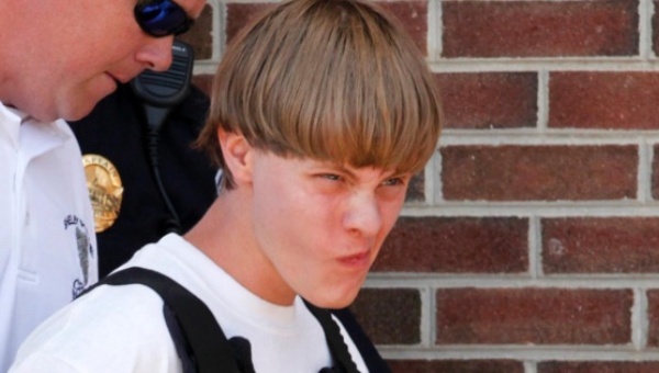 Police lead suspected shooter Dylann Roof 21 into the courthouse in Shelby North Carolina