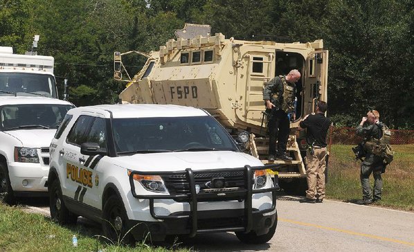 Armed shooter on the run after gunning down two police officers with semi-automatic weapon in the US