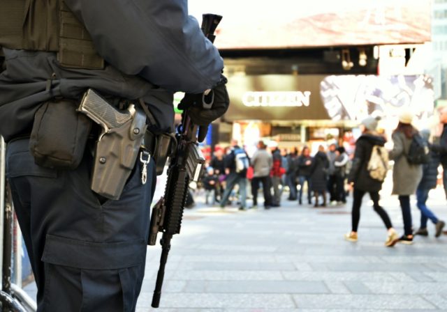 A New York Police Department officer patrols in Times Square in New York