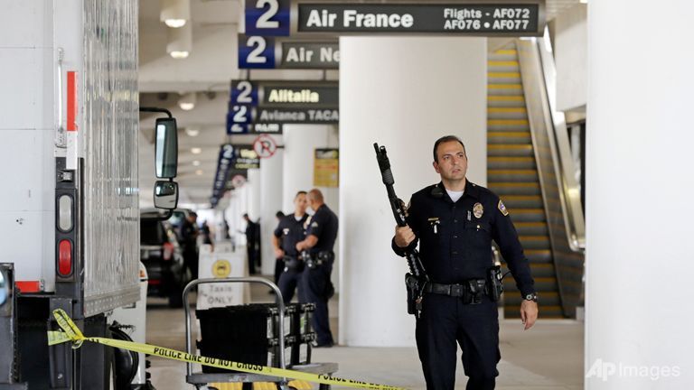 Police stand guard in Terminal 2 at Los Angeles International Airport.
   
 

  Enlarge  Caption