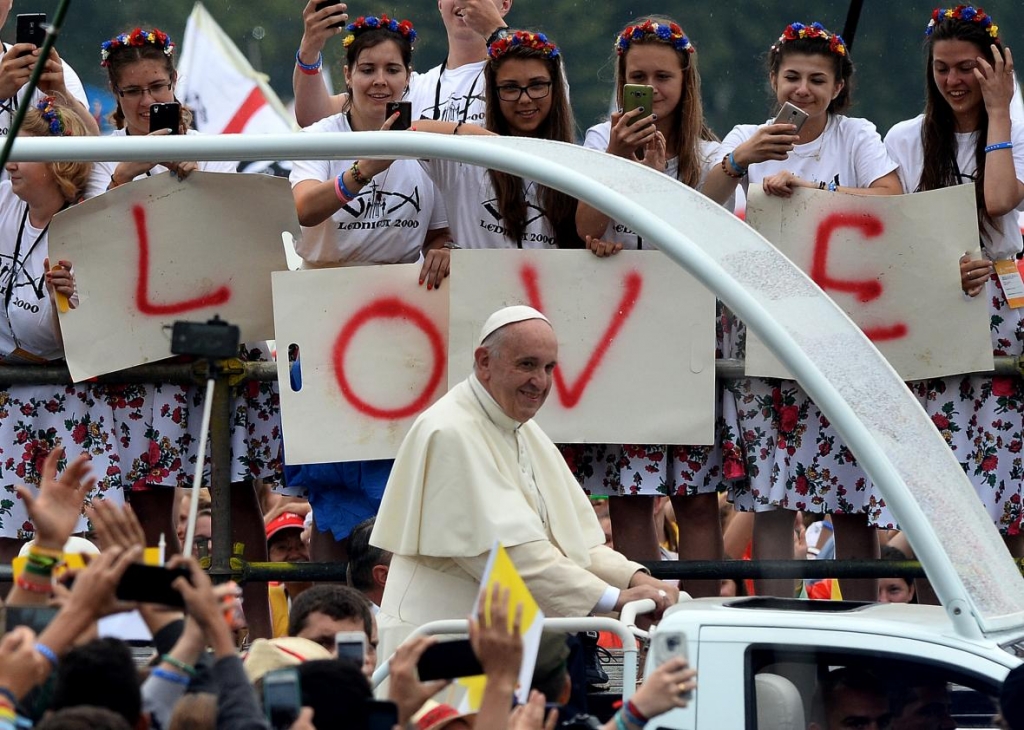 584171972-pope-francis-in-popemobile-arrives-at-blonia-park-on