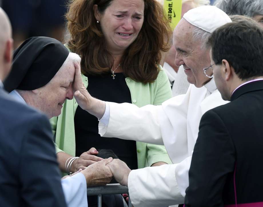 Pope Francis blesses a nun in Philadelphia last September. The pontiff has named a 12-member commission to study the possibility of women serving as Catholic deacons a possible breach in the church's all-male clergy