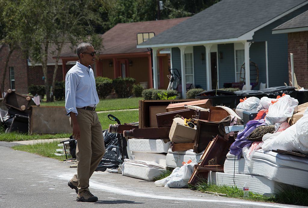 President Barack Obama touched down in flood-stricken Louisiana Tuesday hoping to offer support to devastated communities and silence his critics who say