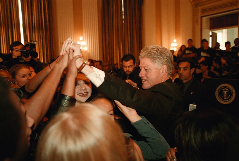 President Bill Clinton joins teens as he kicks off a'Voices Against Violence  conference in October 1999