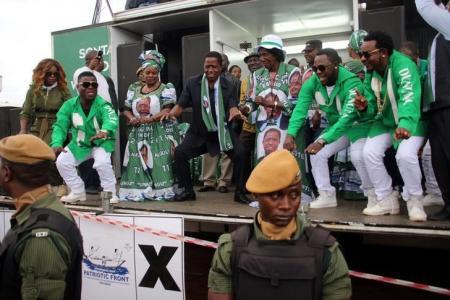 Edgar Lungu, leader of the Patriotic Front party, dances before addressing his supporters during a rally ahead of Thursday's presidential elections in the capital Lusaka Zambia