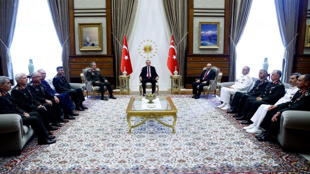 President Recep Tayyip Erdogan holds court with military chiefs during a meeting in Ankara on Friday