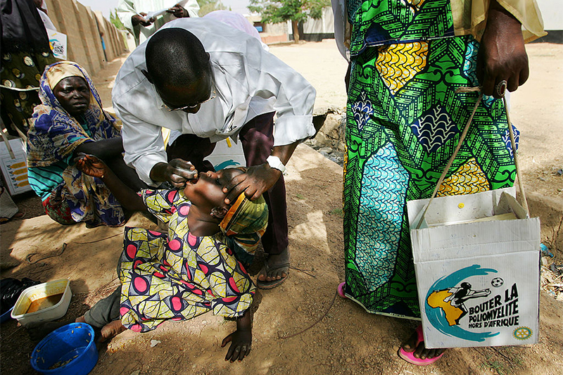 A girl being vaccinated against polio in Nigeria