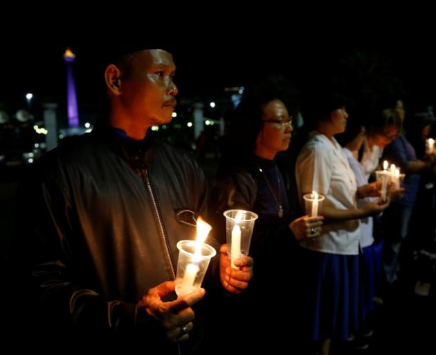 Protesters demonstrated outside the Presidential Palace in Jakarta on Thursday