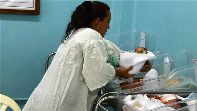 A mother takes care of her baby who was born with microcephaly in the Intensive Care Unit of the South Hospital in Choluteca south of Tegucigalpa Honduras