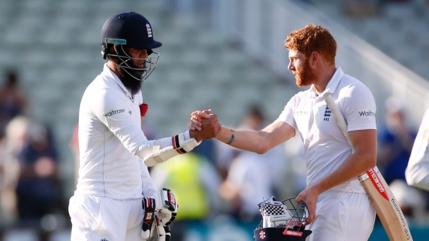 England's Moeen Ali and Jonny Bairstow and at the end of the days play