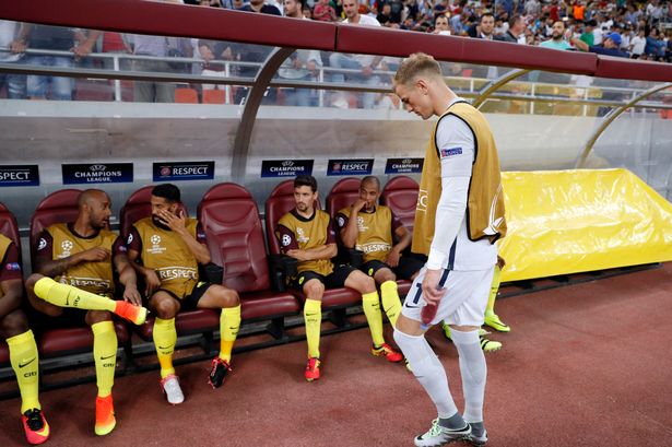 Manchester City's Joe Hart walks towards the substitutes bench