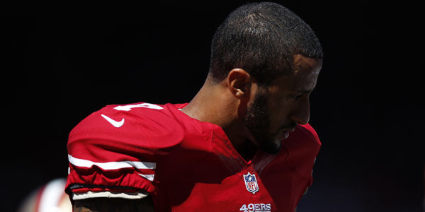 San Francisco 49ers Colin Kaepernick stands on the field before his NFL season home opener football game against the Green Bay Packers in San Francisco