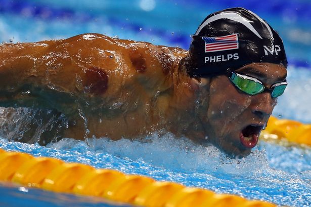 Michael Phelps competes during the Men's 200m Butterfly Final