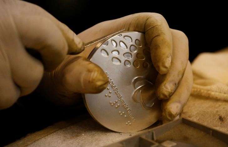 A worker from the Casa da Moeda do Brasil prepares a Rio 2016 Paralympic medal in Rio de Janeiro Brazil