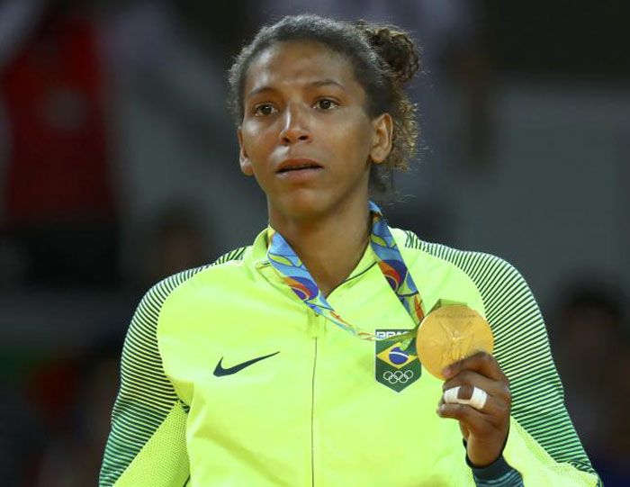 Rafaela Silva of Brazil poses with her gold medal in the 57kg division of the judo competition at the Rio Olympics Monday. — Reuters