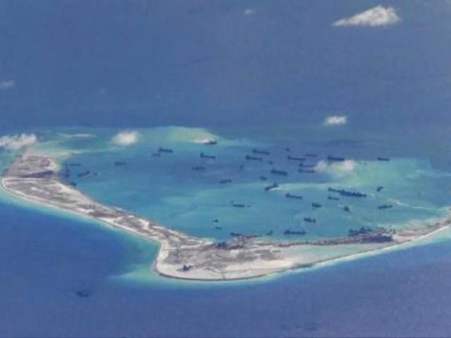 Chinese dredging vessels are purportedly seen in the waters around Mischief Reef in the disputed Spratly Islands in the South China Sea