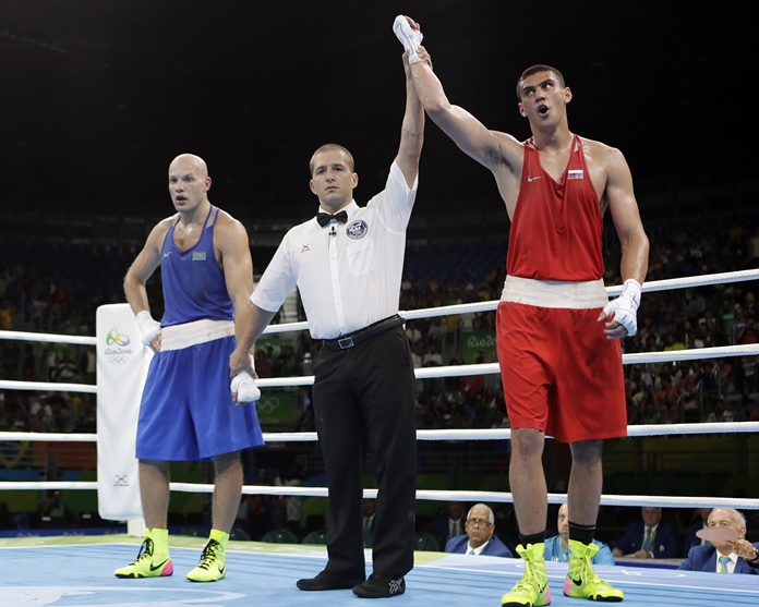 Russia's Evgeny Tishchenko reacts as he win the gold medal for men's heavyweight 91-kg final boxing match against Kazakhstan's Vassiliy Levit at the 2016 Summer Olympics in Rio de Janeiro Monday Aug. 15