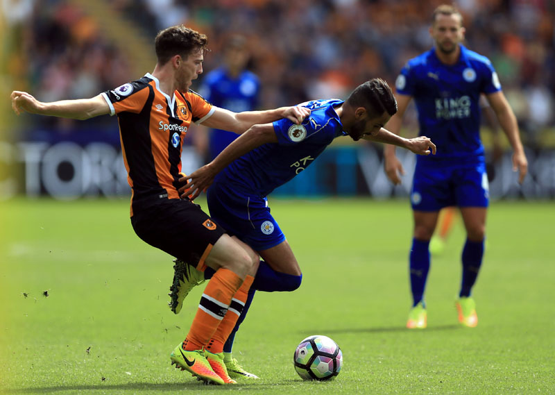 Hull City's Andrew Robertson left and Leicester City's Riyad Mahrez in action during their English Premier League soccer match at the KCOM Stadium Hull England on Saturday Aug. 13 2016