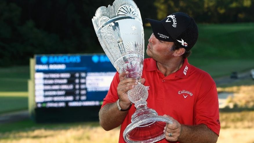 Patrick Reed kisses the trophy after winning The Barclays golf tournament in Farmingdale N.Y. Sunday Aug. 28 2016