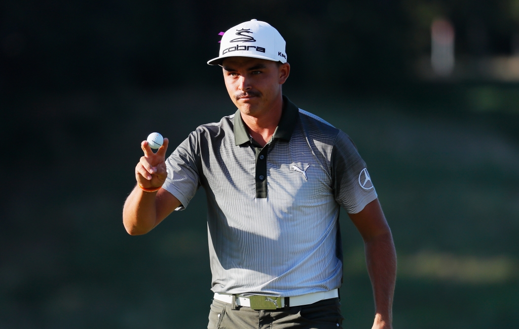 Rickie Fowler waves to the on the 18th green after a three-under par 68 during the third round of The Barclays in the PGA Tour FedExCup Play Offs on the Black Course at Bethpage State Park