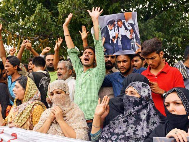 Relatives and neighbours of Zulfiqar Ali who was sentenced to death in Indonesia protest in Lahore