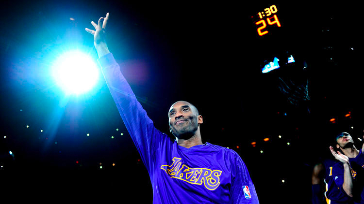 Kobe Bryant waves to the crowd as he is introduced before a game against the Thunder in Oklahoma City on April 11