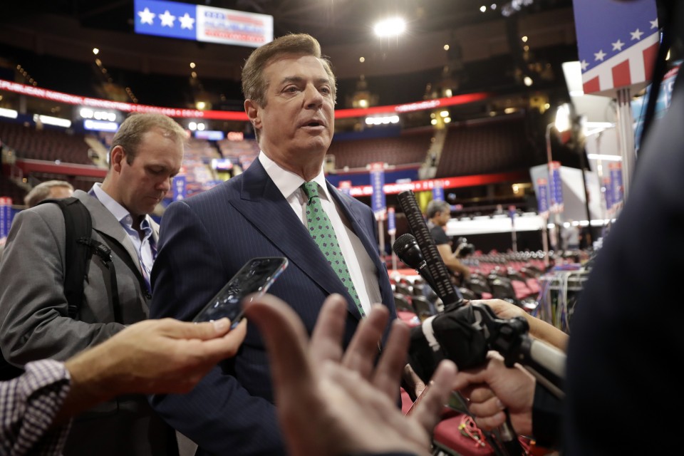 Trump Campaign Chairman Paul Manafort is surrounded by reporters on the floor of the Republican National Convention at Quicken Loans Arena Sunday