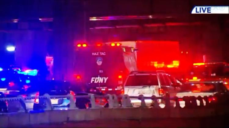 Rescue vehicles are on the scene at the site of a multiple car crash on the Long Island Expressway near Maspeth in Queens