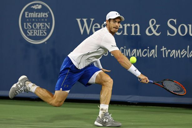 Andy Murray returns a shot against Juan Monaco