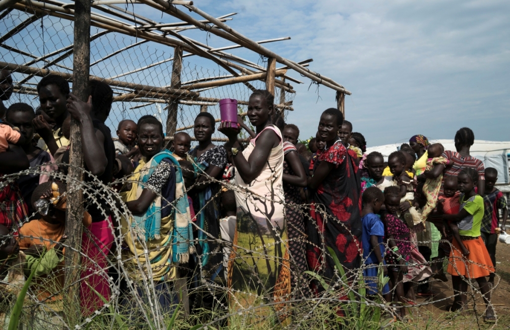 ReutersSouth Sudanese women and children queue to receive emergency food after being displaced during the recent fighting in Juba