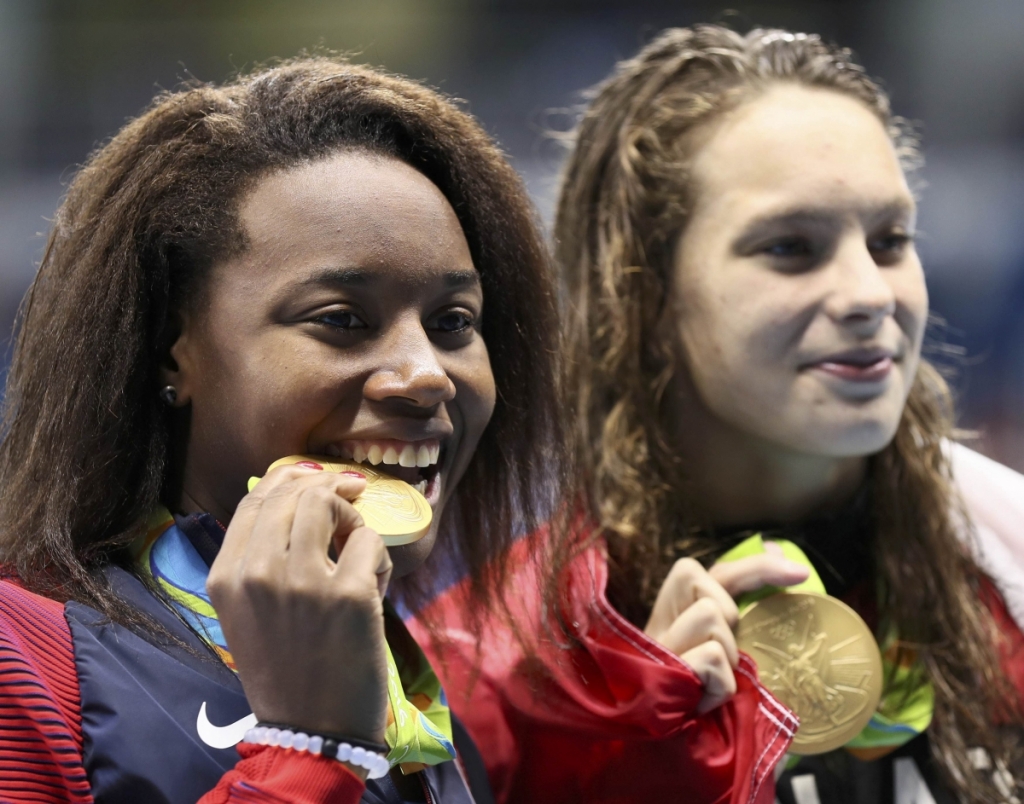 ReutersThe 20-year-old from Sugarland Texas won the gold in the 100m freestyle event tying with the Canadian swimmer Penny Oleksiak